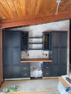 Interior stone kitchen wall with wood ceiling