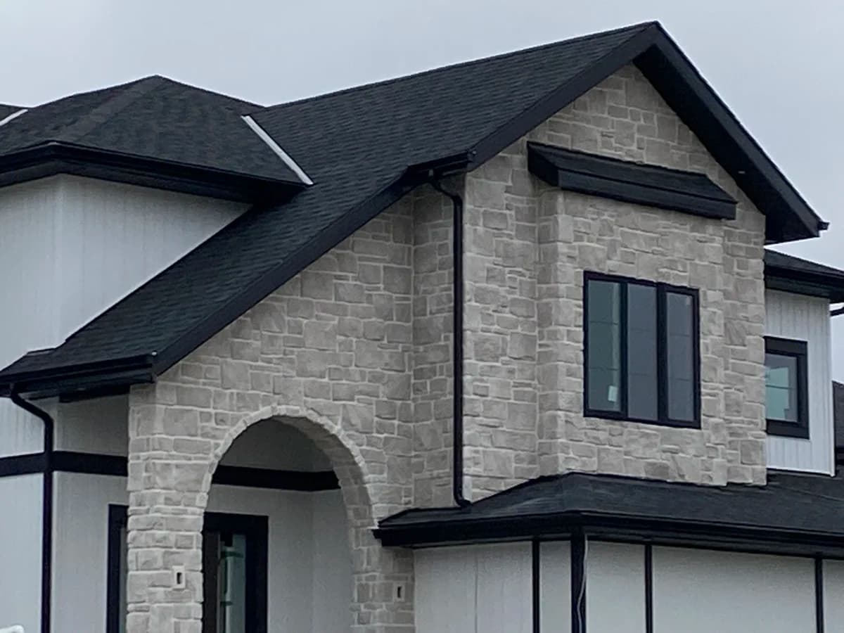 Grey stone veneer residential home